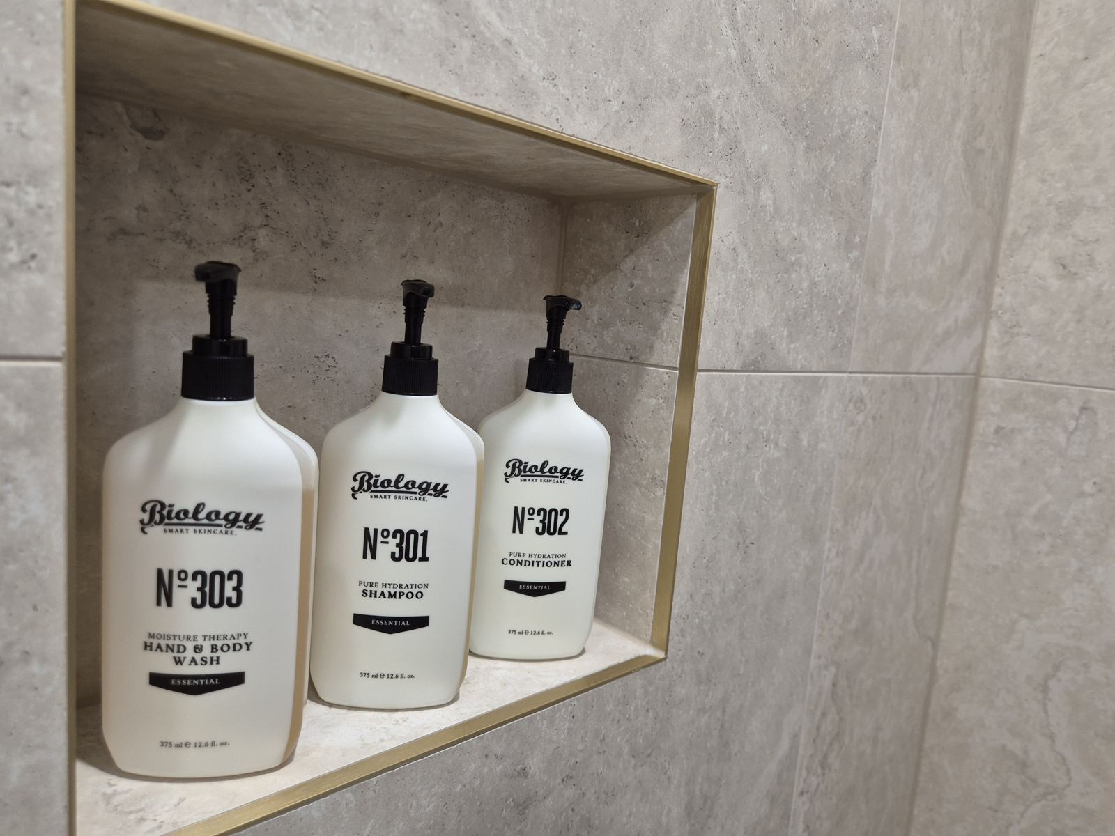 Biology Smart Skincare hand and body wash, shampoo and conditioner in the shower niche